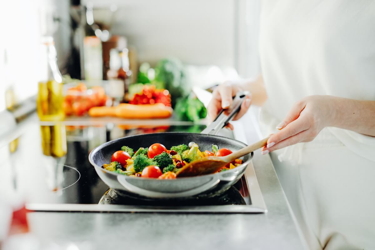 Woman Cooking Vegetables Without Oil