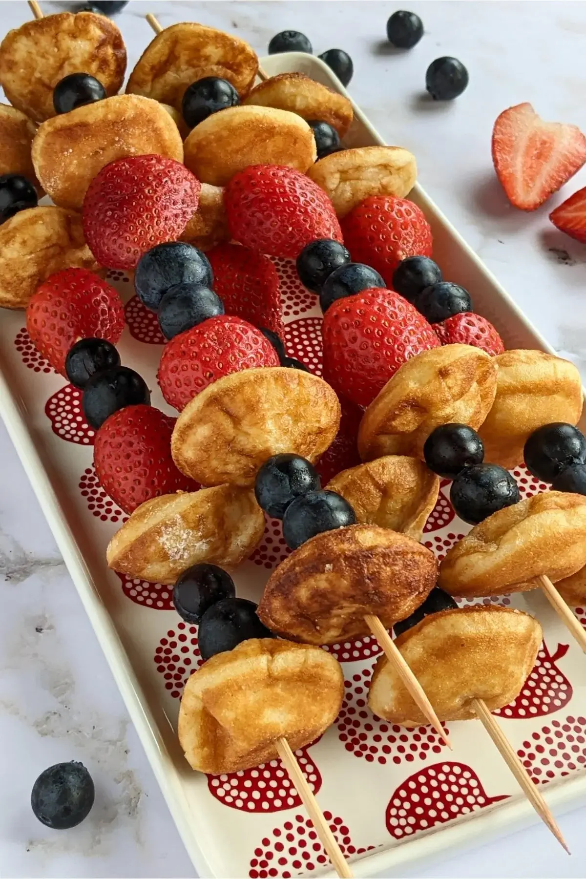 Mini pancakes and fresh berries skewered together for a colorful, kid-friendly summer snack.