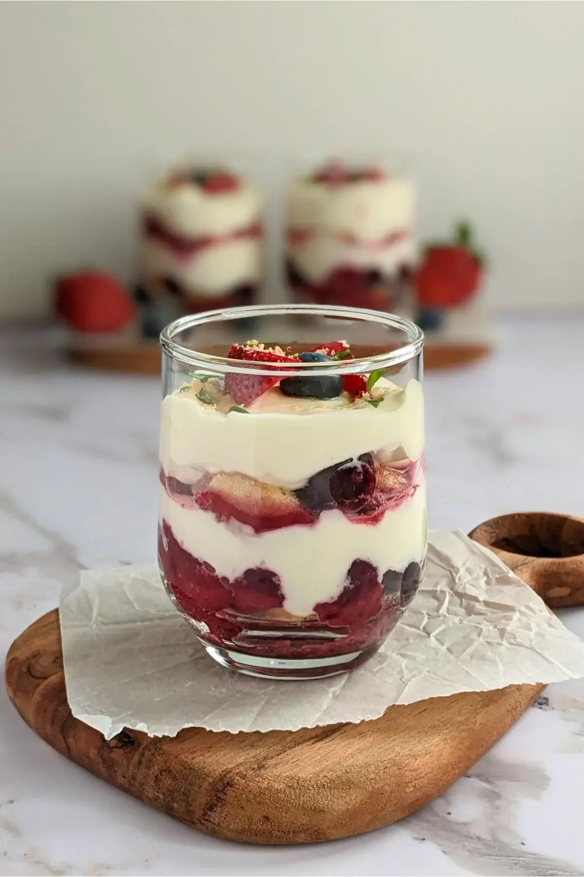 Healthier take on tiramisu made with mascarpone, Greek yogurt, ladyfingers, and a sweet mixed berry compote.