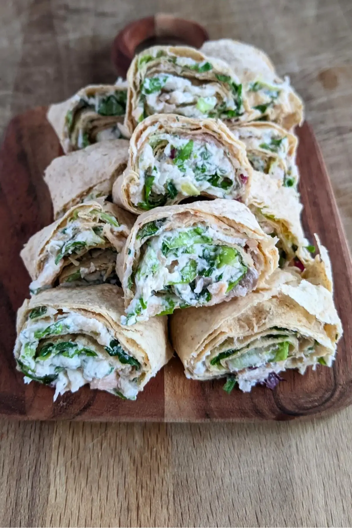 Soft flatbread rolled with smoked salmon, cream cheese, and herb mix for an easy, elegant appetizer.