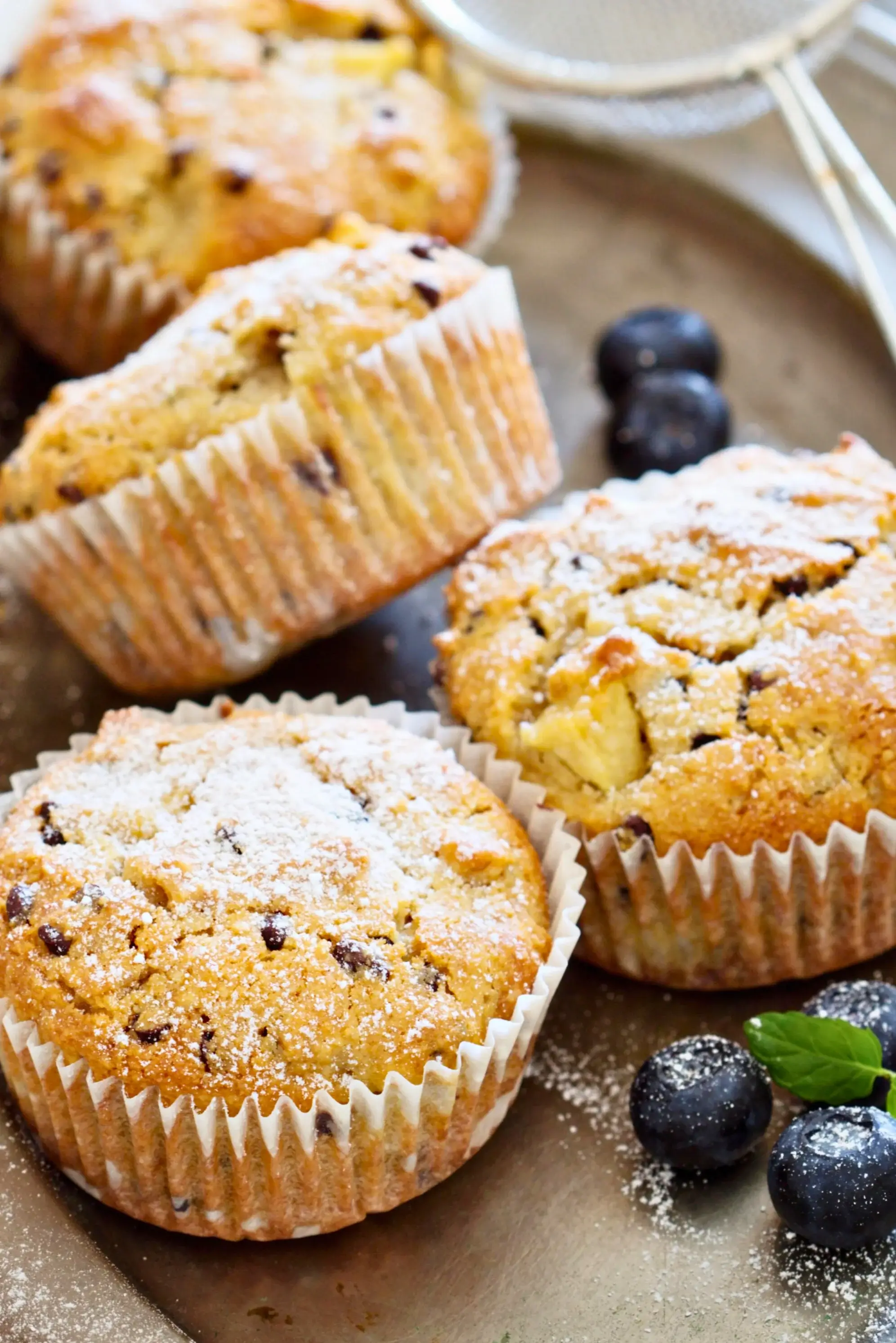Moist apple muffins made with almond flour, showing a chewy, golden texture.