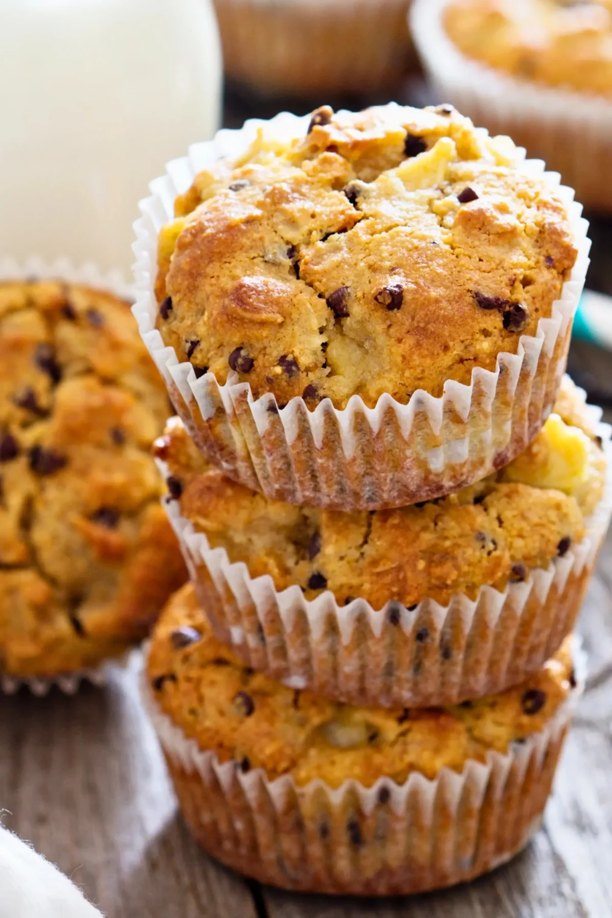 Moist apple muffins made with almond flour, showing a chewy, golden texture.