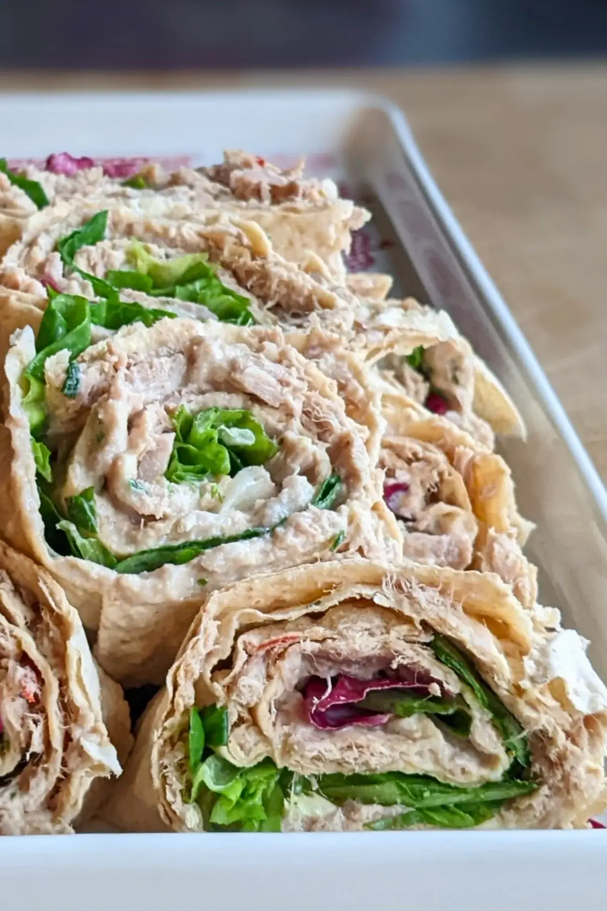 Tuna flatbread lavash rolls filled with a mix of tuna, mustard, Greek yogurt and fresh salad leaves.