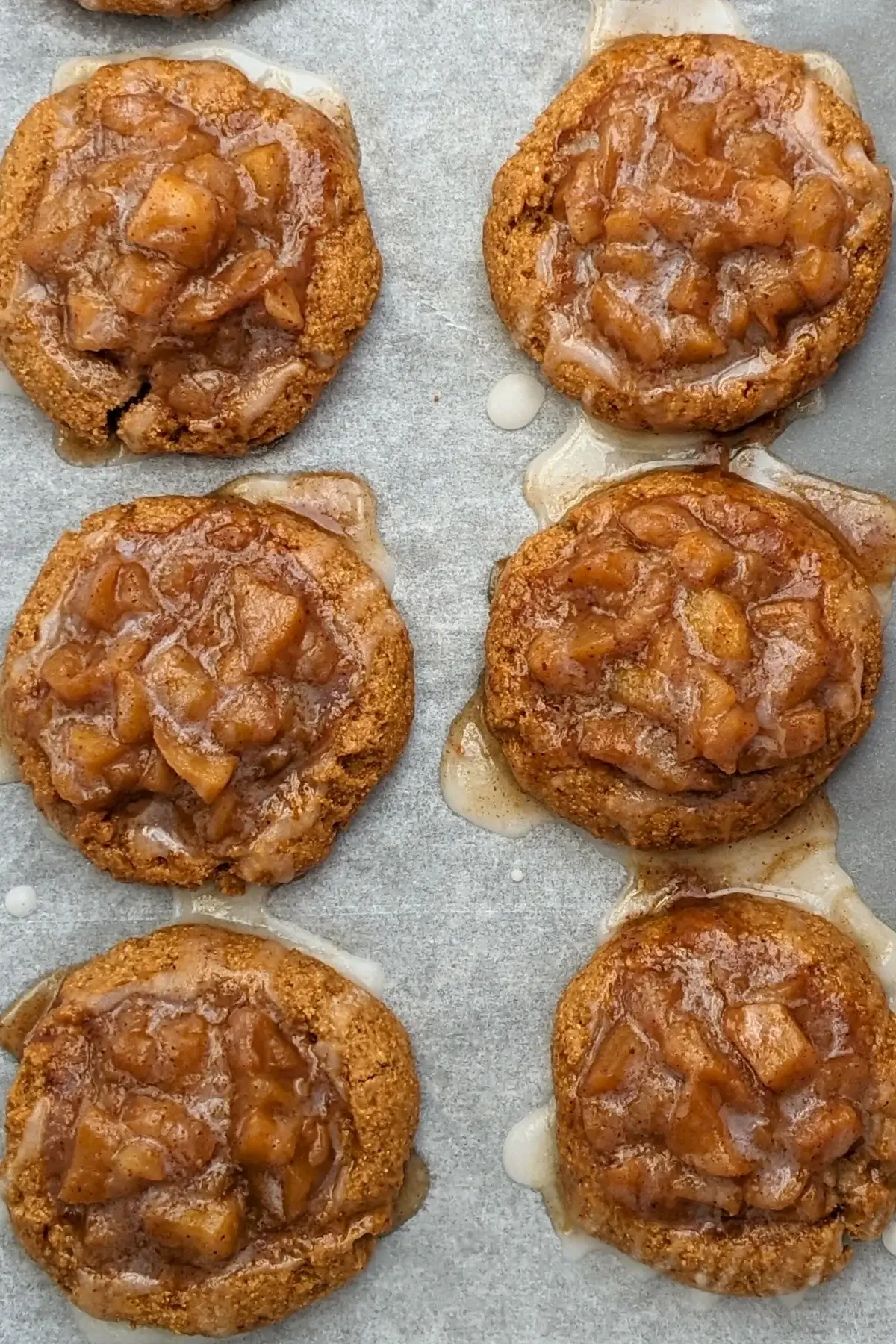 Apple pie thumbprint cookies - cookies made with wholemeal flour and coconut sugar, filled with a cinnamon apple pie filling and topped with a simple powdered sugar/milk icing.
