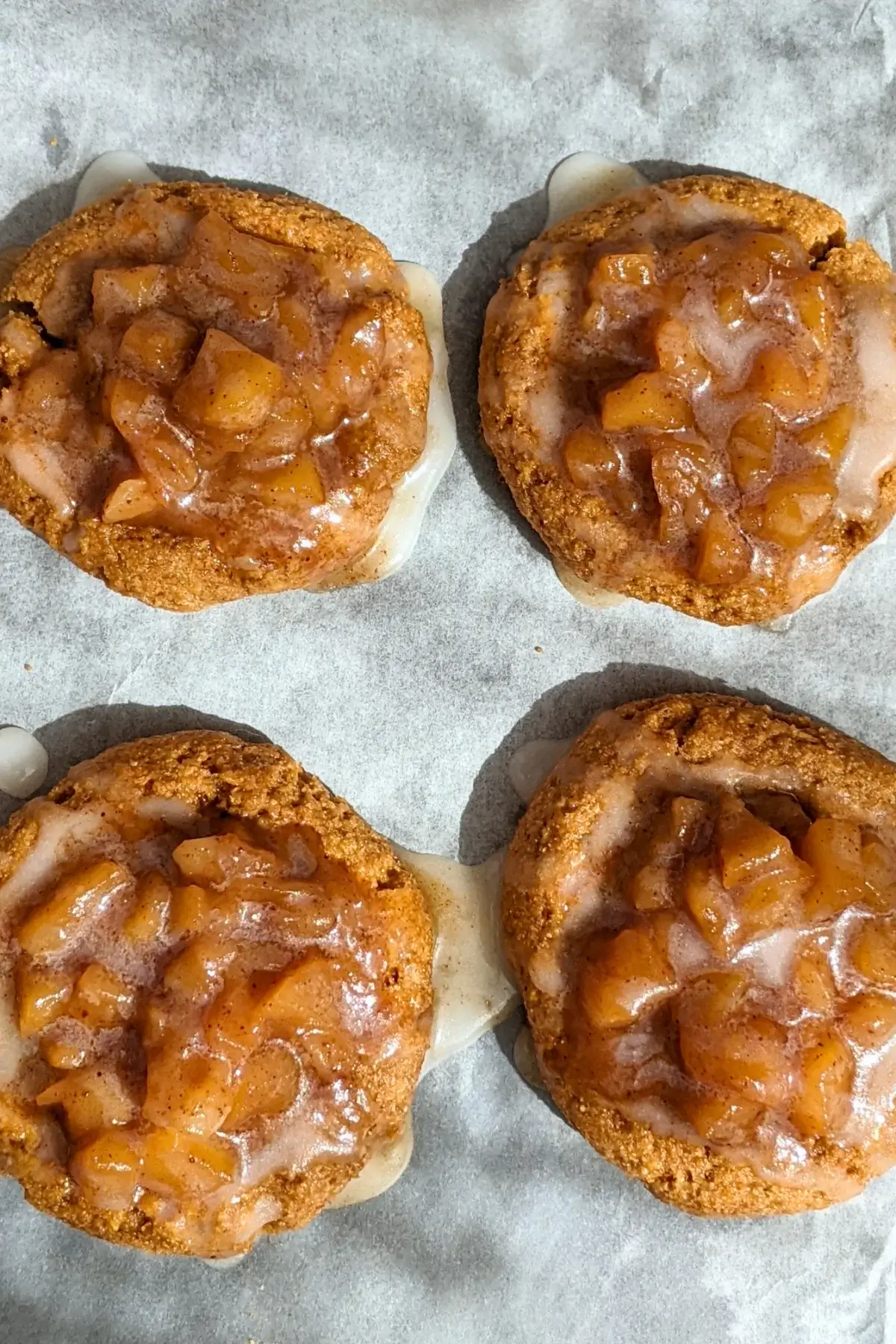 Apple pie thumbprint cookies - cookies made with wholemeal flour and coconut sugar, filled with a cinnamon apple pie filling and topped with a simple powdered sugar/milk icing.