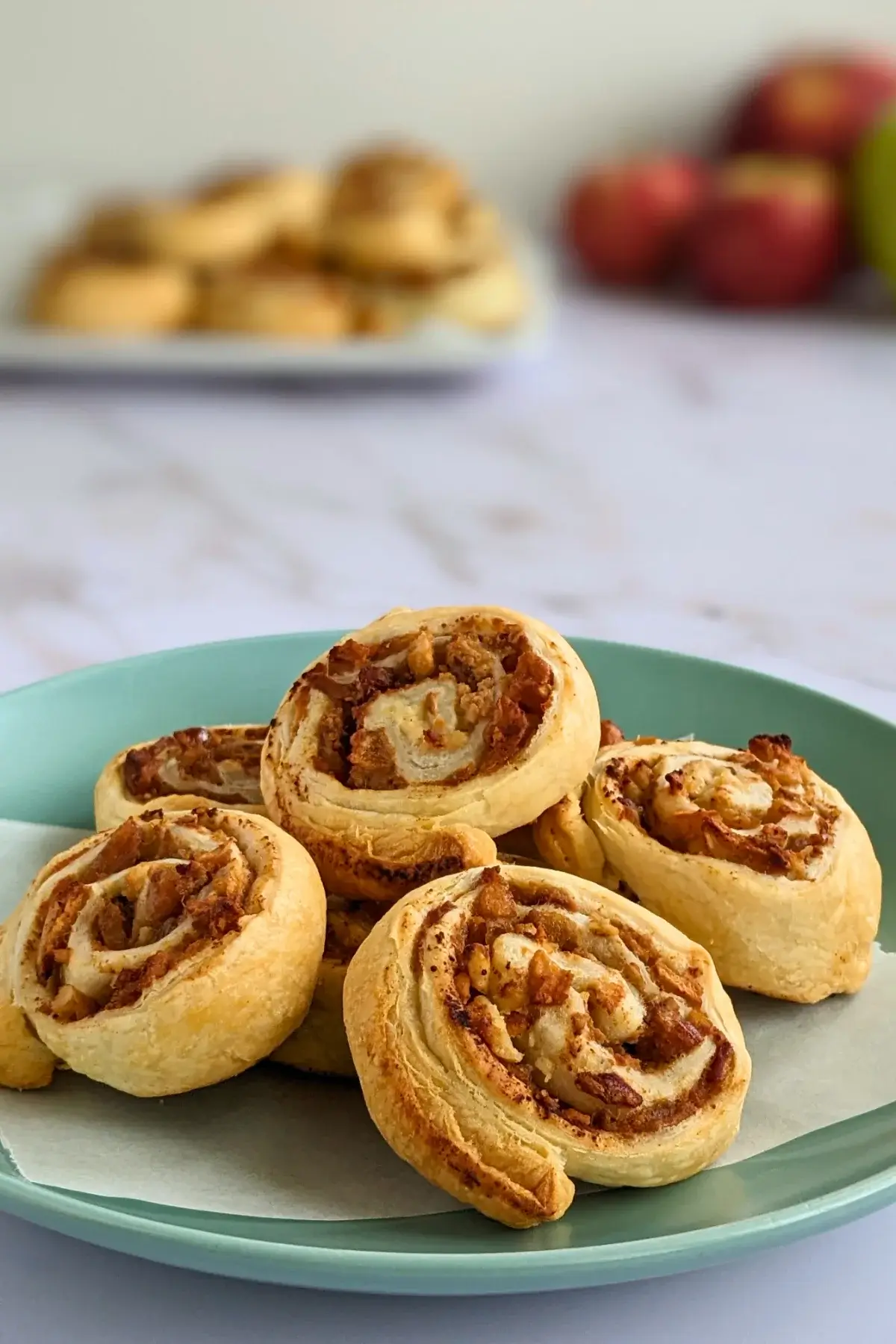 Rolled puff pastry filled with ricotta, cinnamon apples, and walnuts.