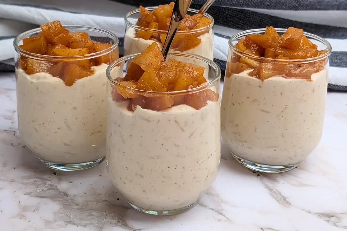 Cinnamon apple rice pudding - rice pudding dessert made with cooked rice and a whipped cream and ricotta blend, topped with cinnamon butter apple pie filling.