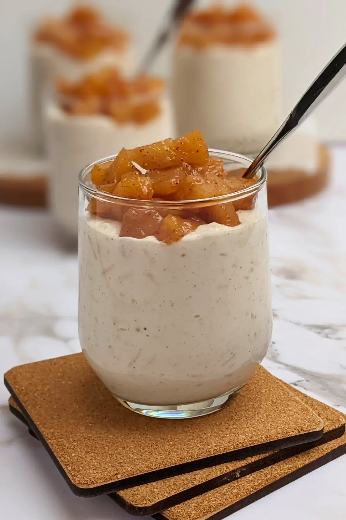Cinnamon apple rice pudding - rice pudding dessert made with cooked rice and a whipped cream and ricotta blend, topped with cinnamon butter apple pie filling.