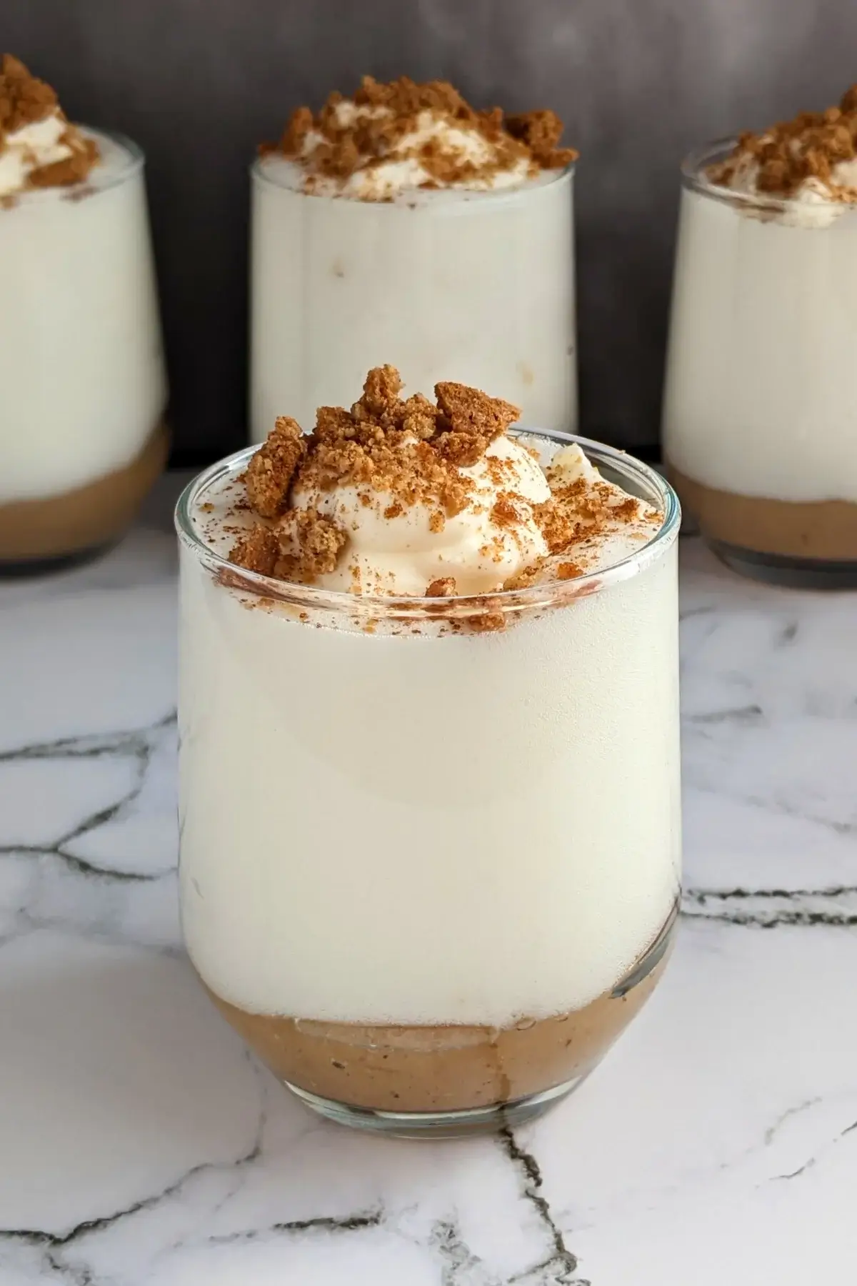 Fluffy apple mousse made with pasteurized egg whites with a smooth, airy consistency, lightly sweetened and served with homemade applesauce at the bottom of the serving glass.