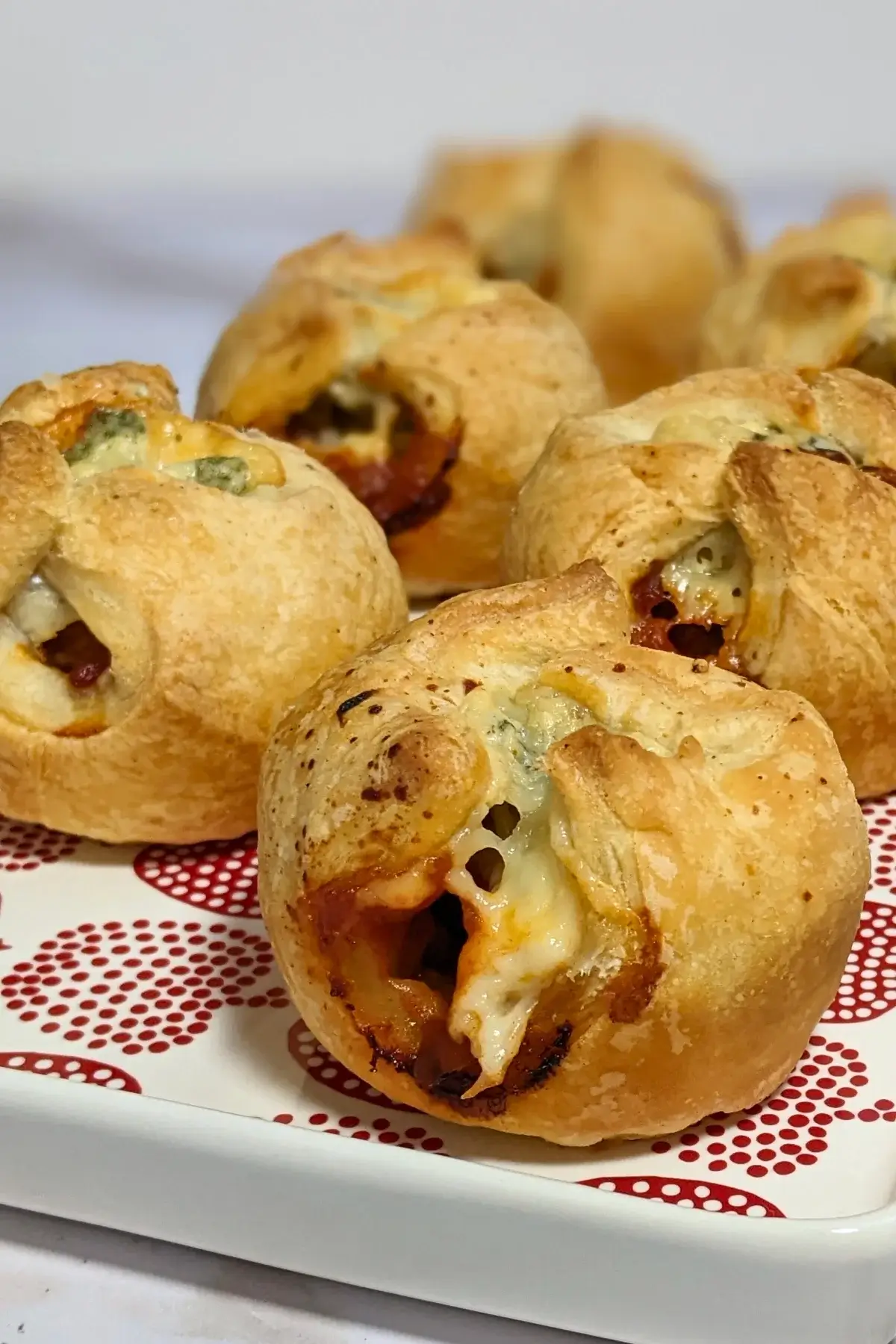 Prosciutto and blue cheese puff pastry appetizers - savory puff pastry cups filled with sweet chili sauce, prosciutto and blue cheese.