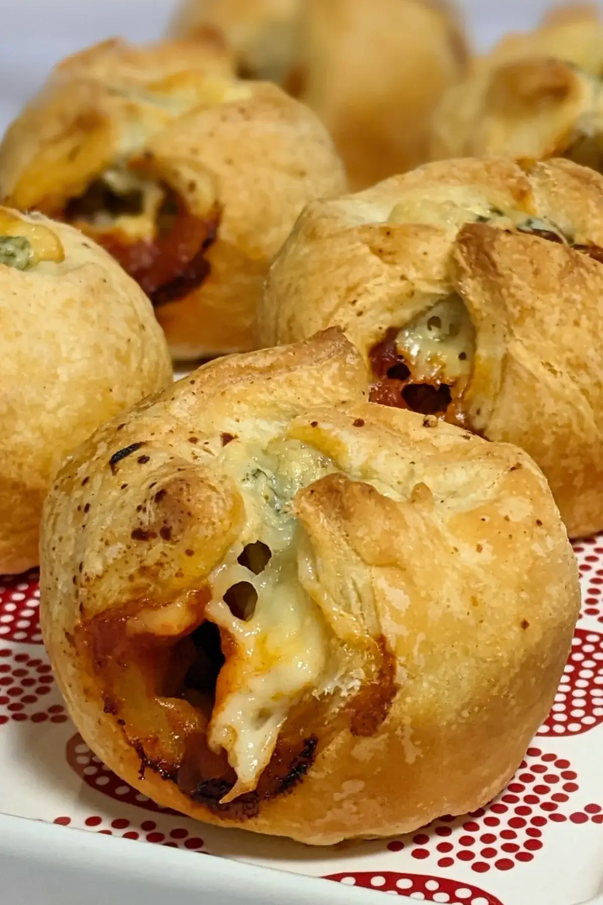 Prosciutto and blue cheese puff pastry appetizers - savory puff pastry cups filled with sweet chili sauce, prosciutto and blue cheese.