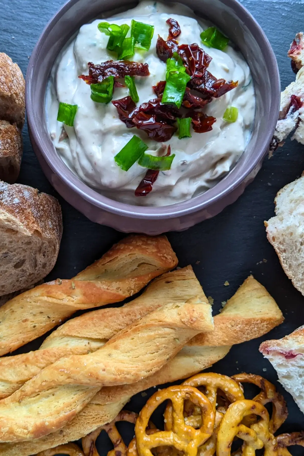 Creamy feta spread blended with sundried tomatoes and herbs, perfect for crackers or fresh bread.